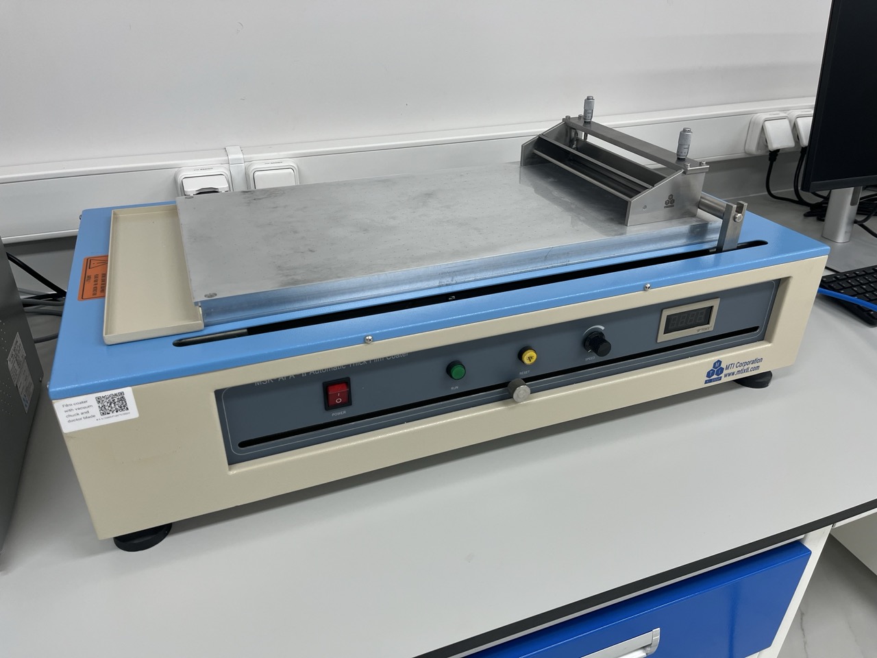 Film coater with doctor blade